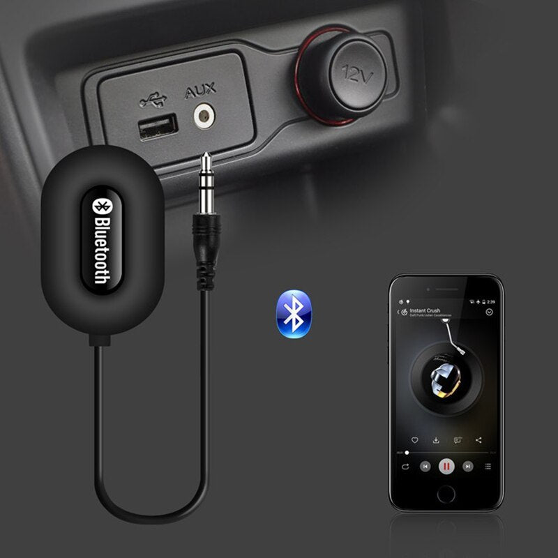 Wireless Bluetooth audio adapter plugged into car AUX port, used for high-speed gaming and streaming KenShu Gaming.